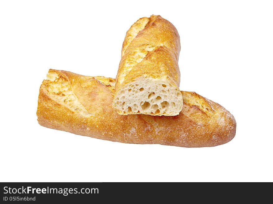 Fresh Crusty the cut baguettes on a wooden background.