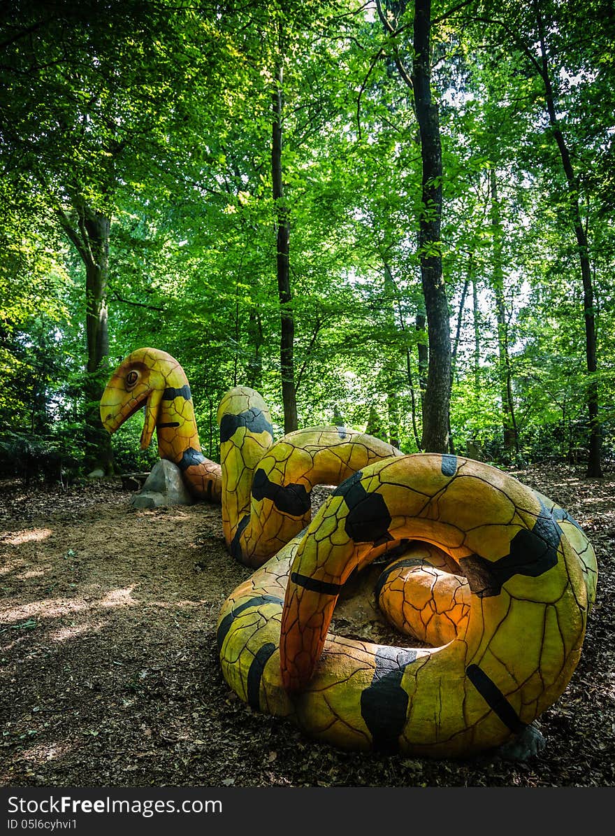 A yellow and black concrete snake