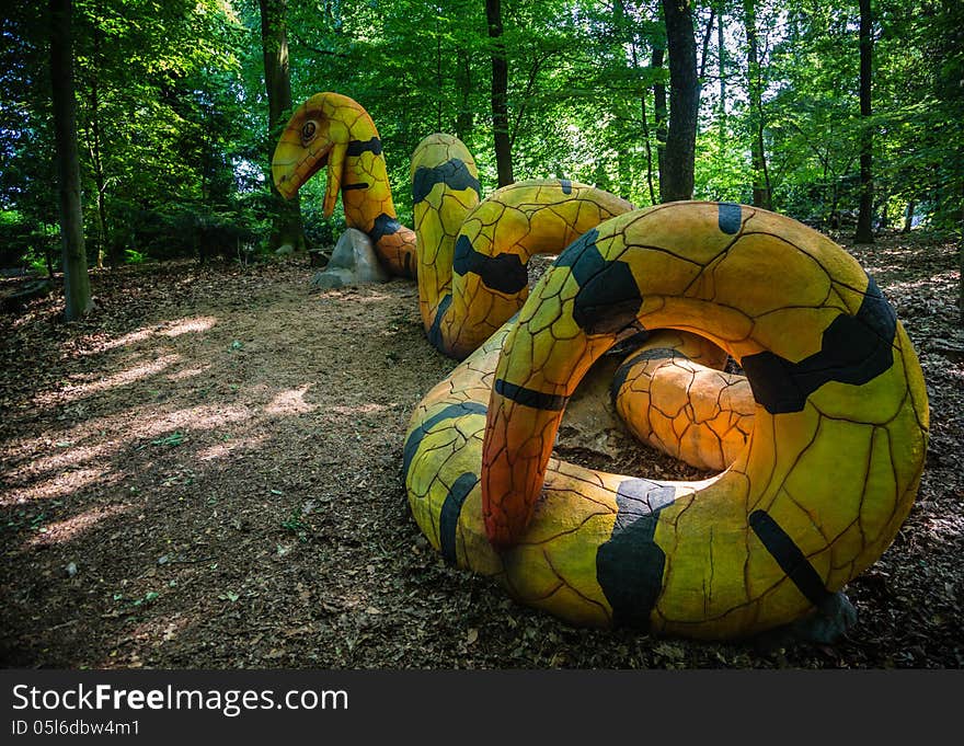 A Yellow And Black Concrete Snake