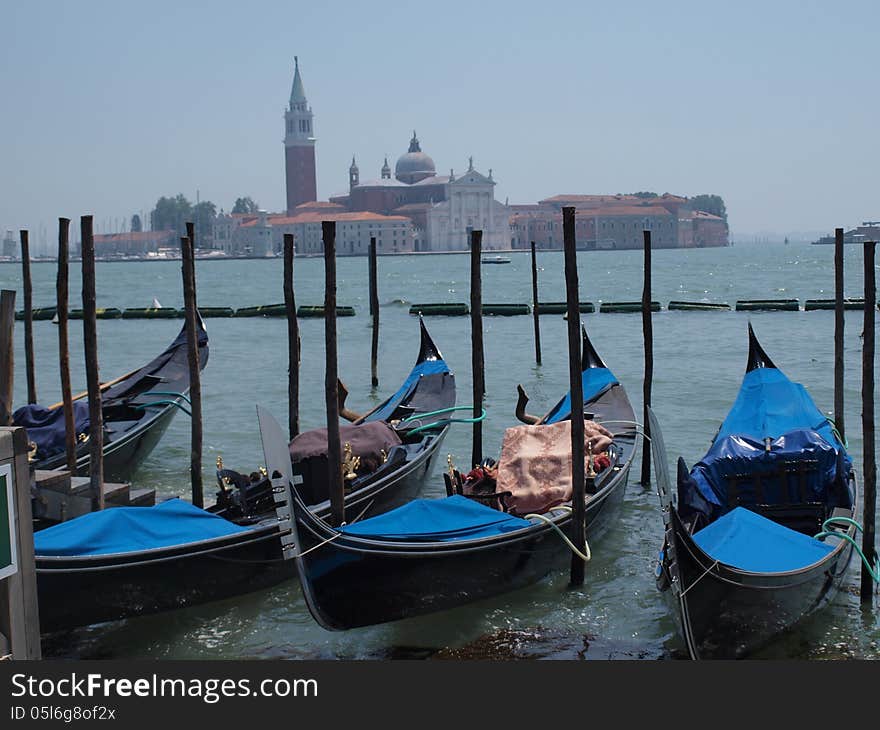 Boats in Venice in front of blue sky and the sea