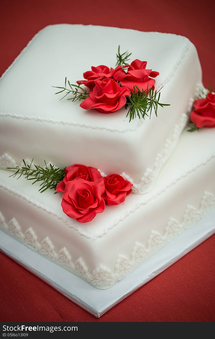 Wedding cake on a red tablecloth
