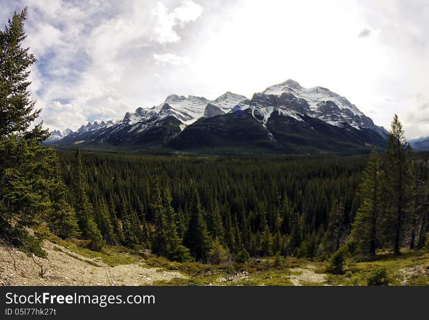 Canadian rocky mountains in the Spring thru a fisheye lens. Canadian rocky mountains in the Spring thru a fisheye lens