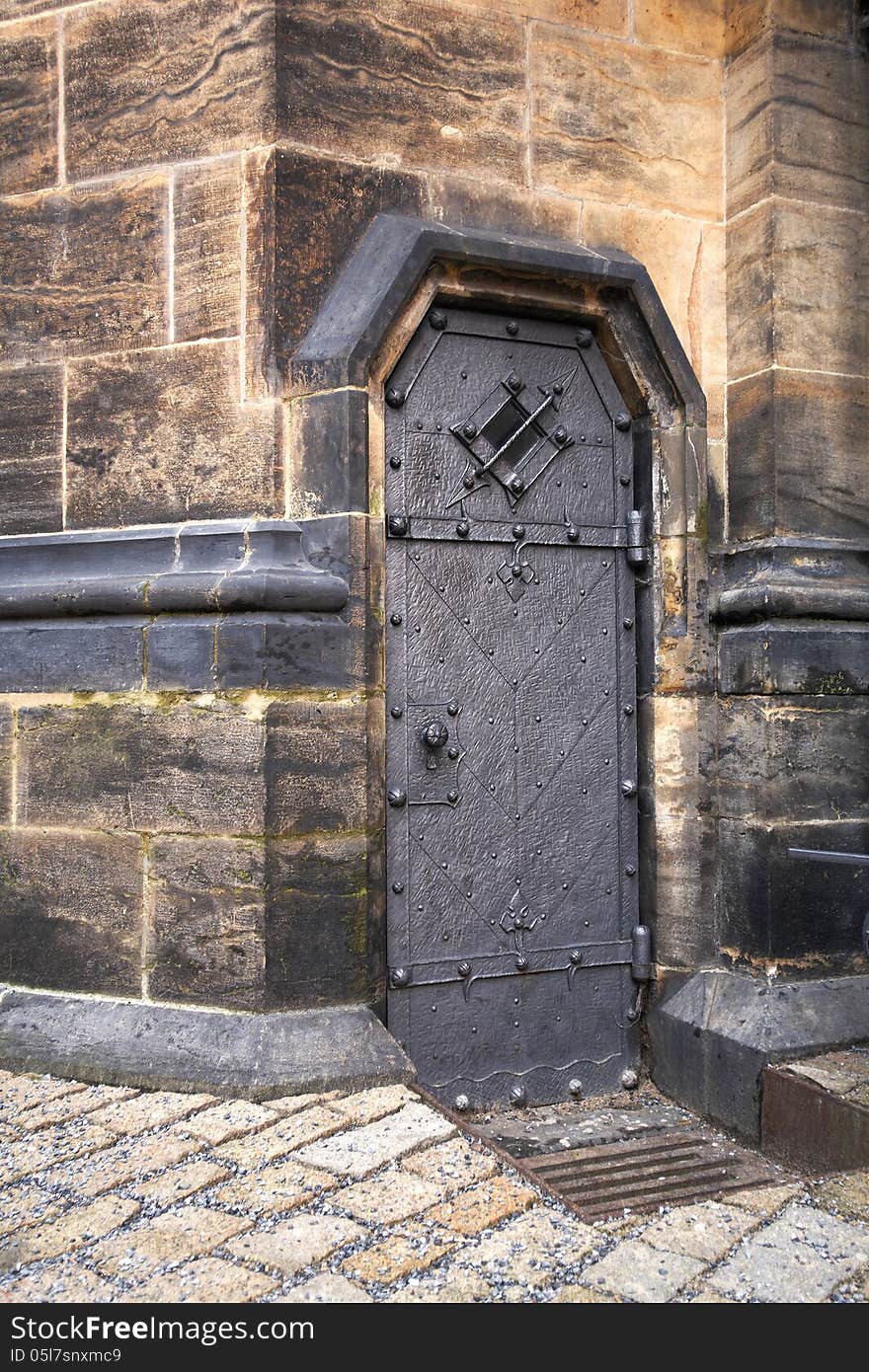 Old metal door to the St.Vitus church in Prague.Czech republic. Old metal door to the St.Vitus church in Prague.Czech republic.