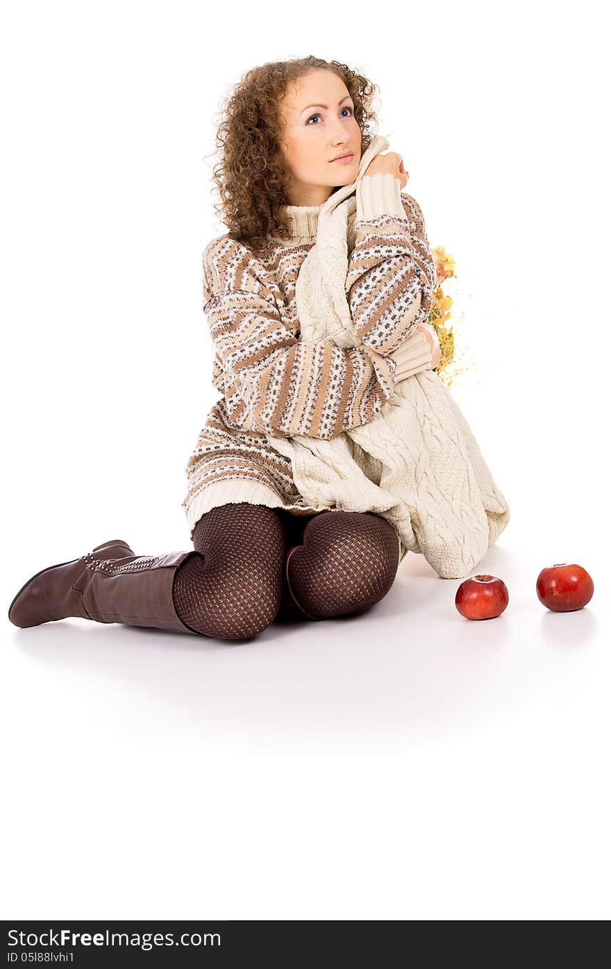 Girl sitting comfortably and is heated with apples