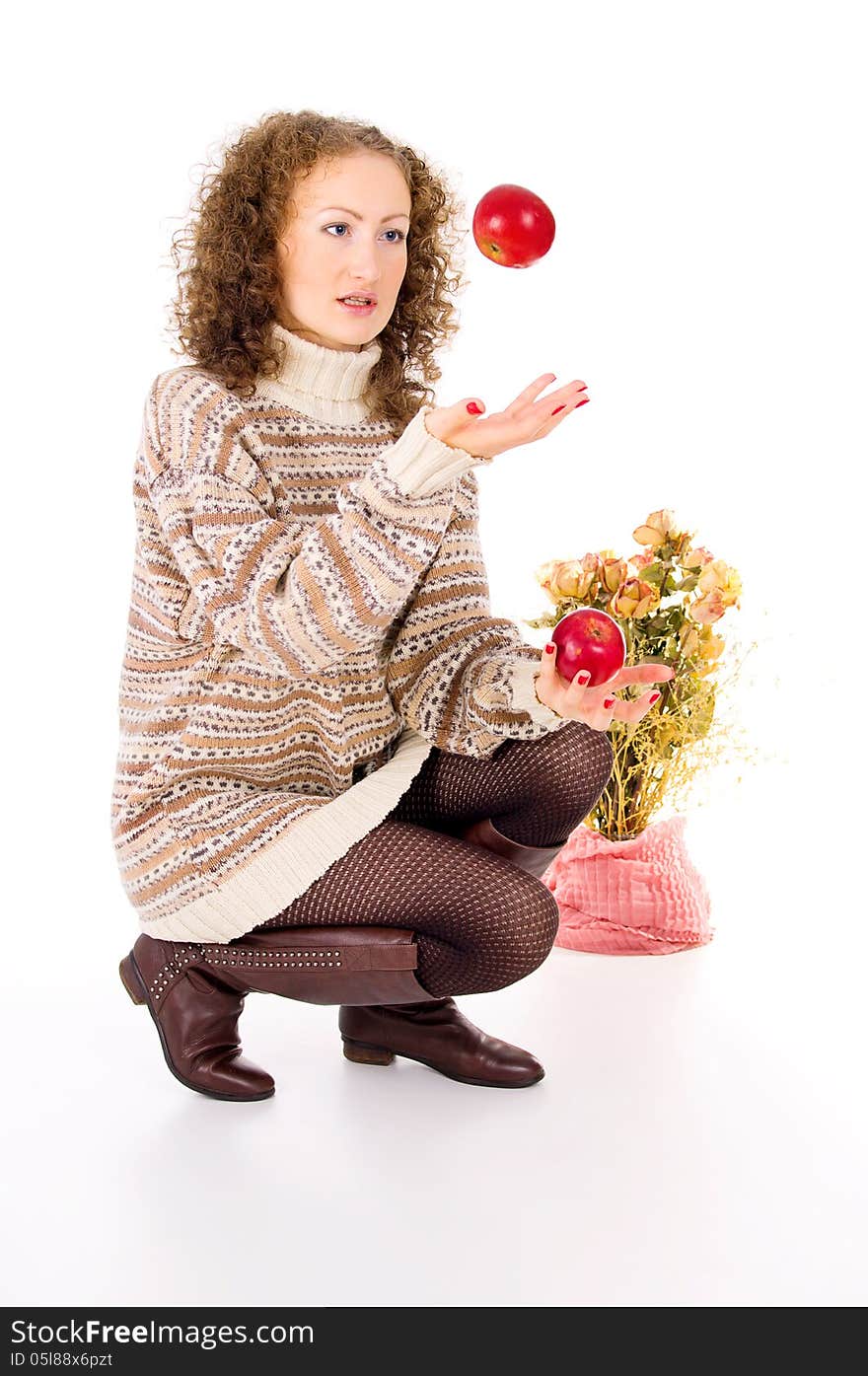 Girl in a sweater and apples