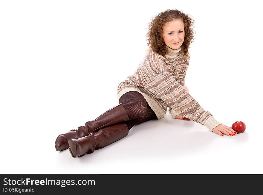 Beautiful girl in a sweater sitting