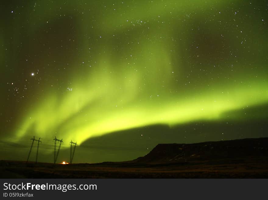 The solar winds activating the Northern lights producing a wonderful light show. The solar winds activating the Northern lights producing a wonderful light show