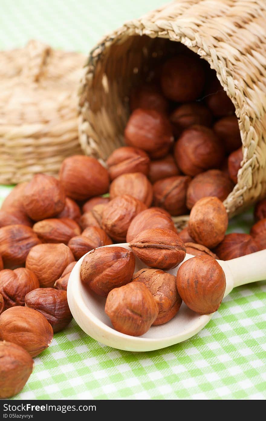 Hazelnuts, Wooden Spoon And Basket