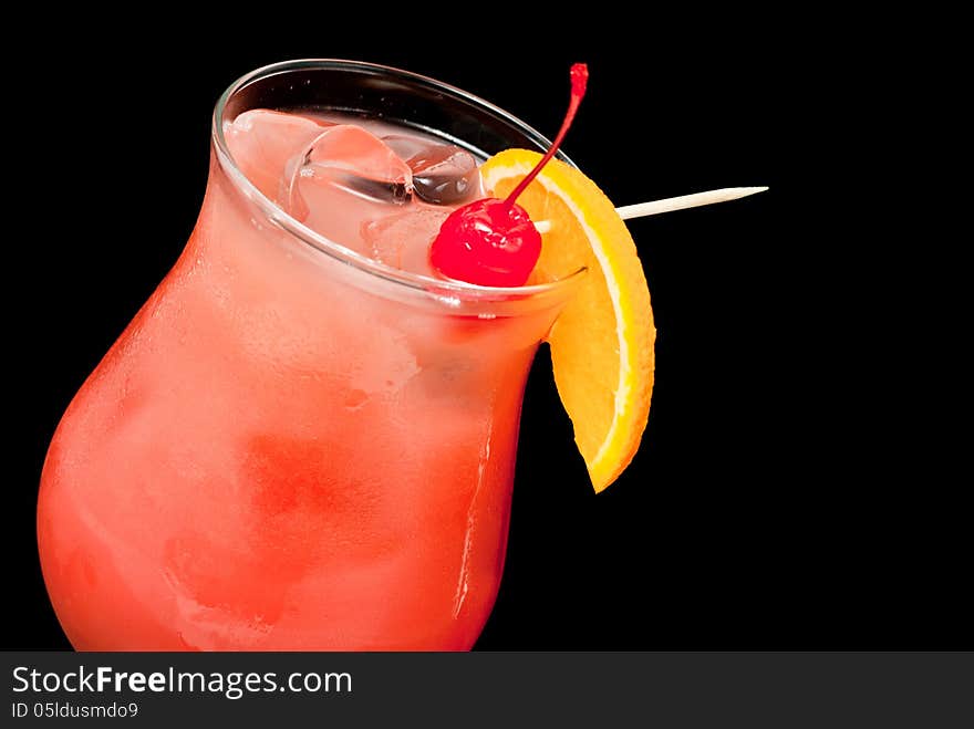 Cocktail with red cherry and orange closeup