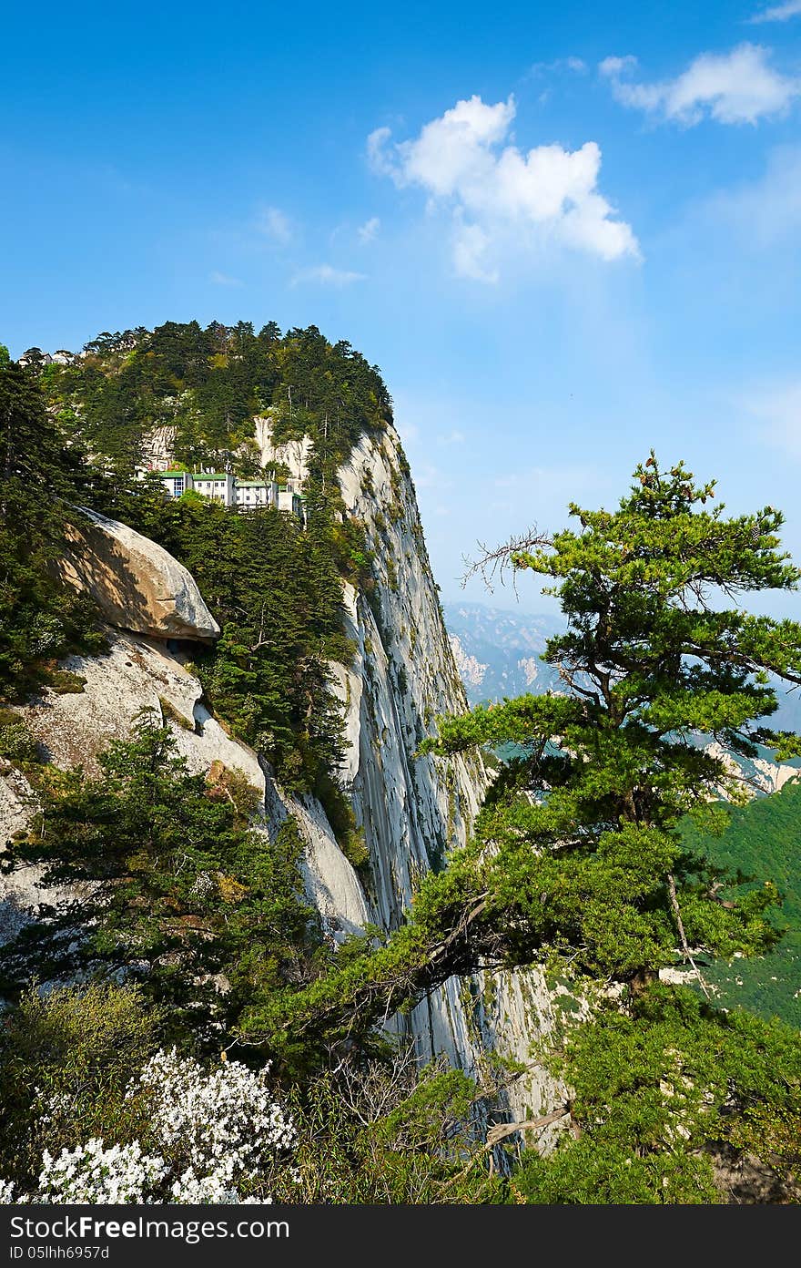 The image taken in chinas shanxi province xian city Hua mountain scenic spot.Time is in 2013 at the beginning of May.Hua mountain consists of five peaks, is Chinas most unique mountain scenic area. The picture is huashan west peak. The image taken in chinas shanxi province xian city Hua mountain scenic spot.Time is in 2013 at the beginning of May.Hua mountain consists of five peaks, is Chinas most unique mountain scenic area. The picture is huashan west peak.