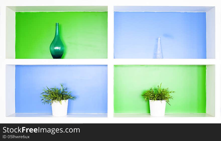 Beautiful colorful shelves with vase.