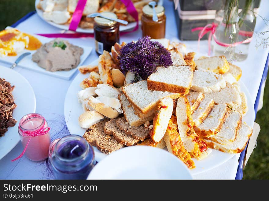 Assortment of bread and condiments served at wedding reception