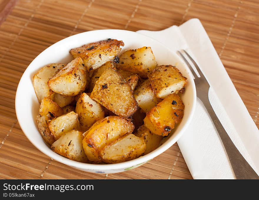 Baked potatoes in a rural, in a bowl on a napkin