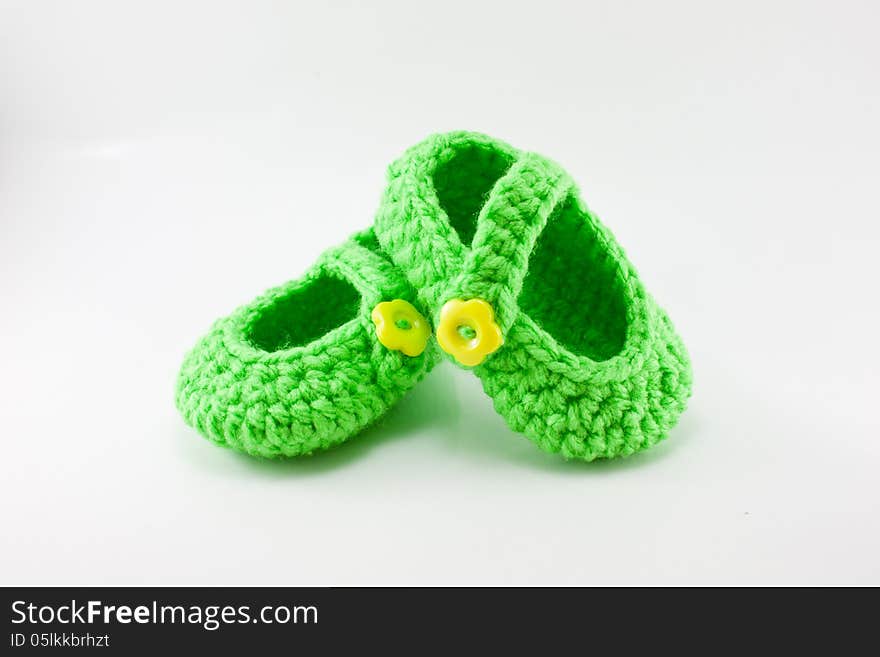 Pair of knitted, bright green baby booties