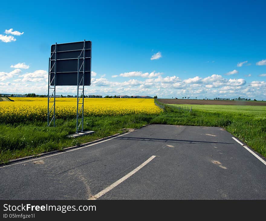 Road sign without street in warm weather