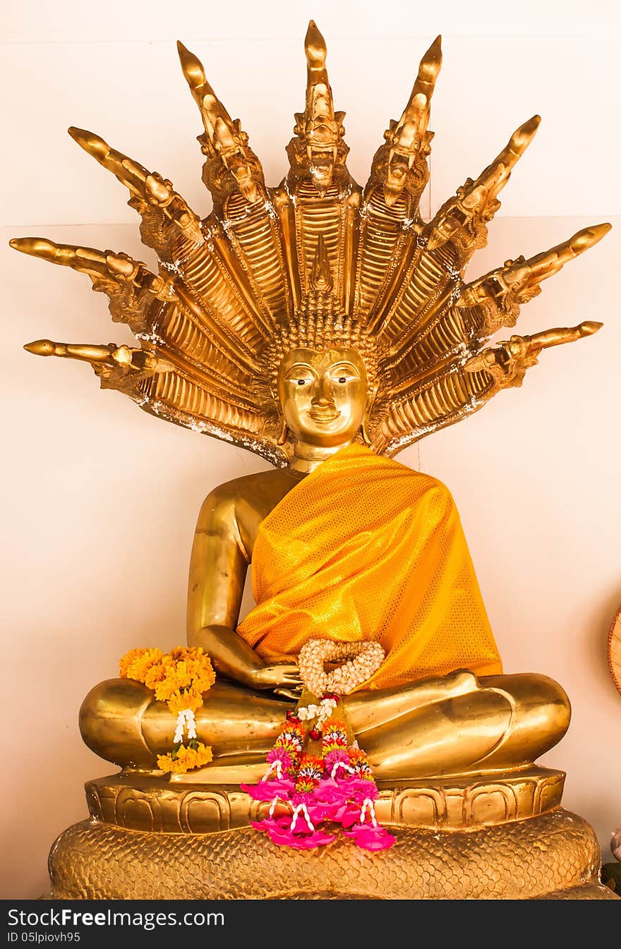 Golden buddha with naga