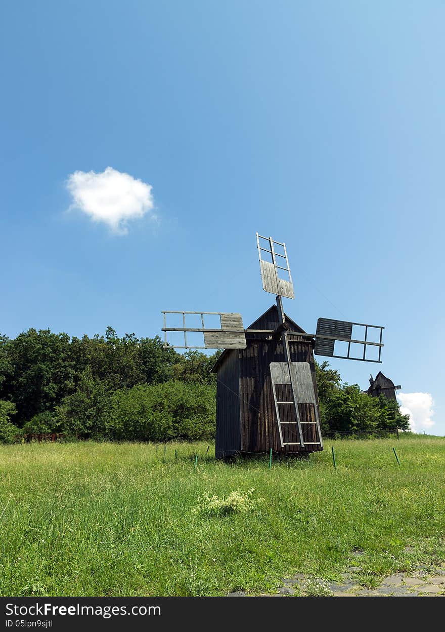 Old wooden windmill near the village in Folk Arts museum Pirogovo, Kiev, Ukraine