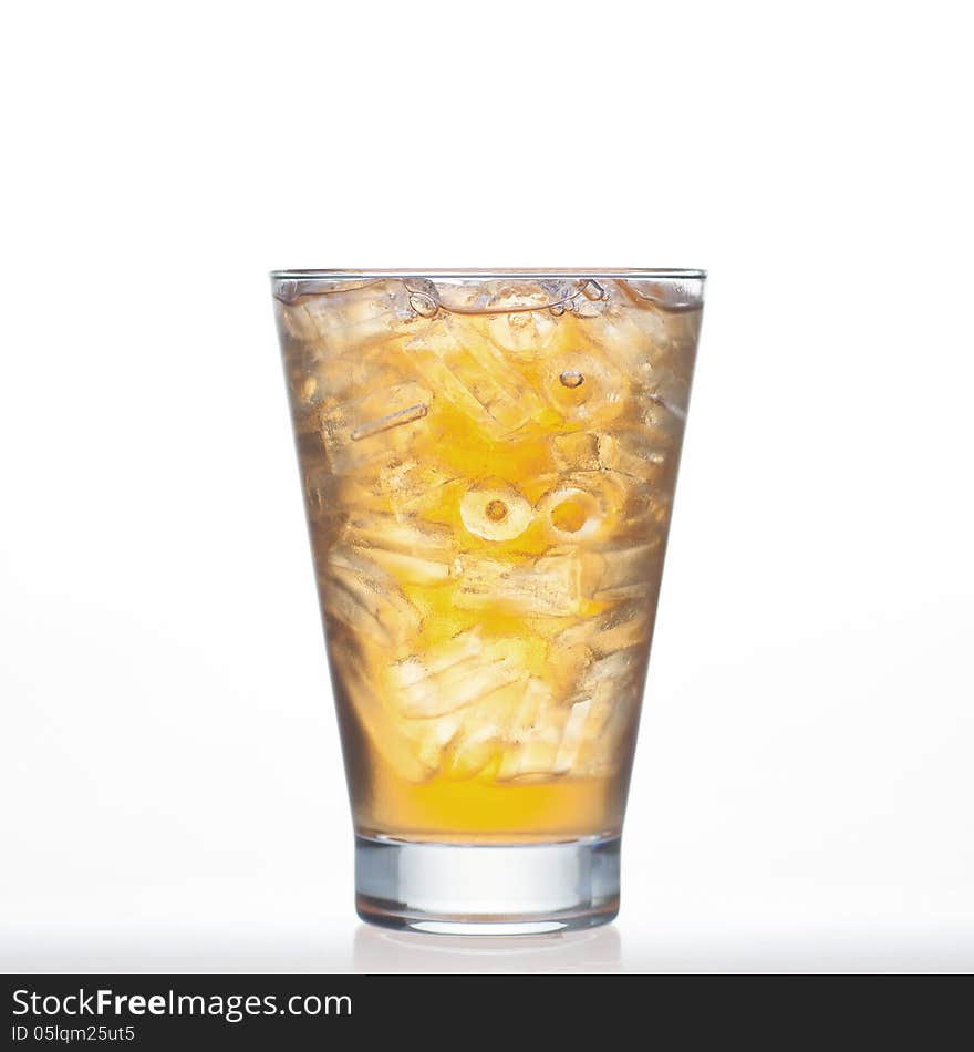 Bael tea Thai drinks style with ice in glass on white background