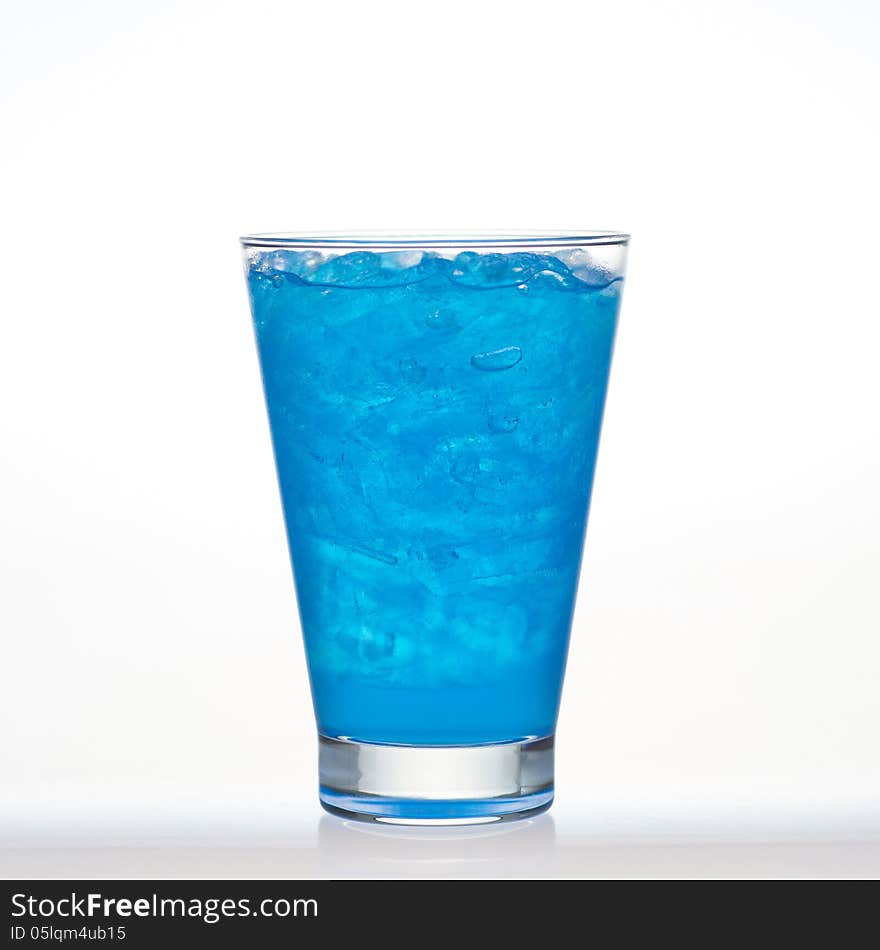 Blueberry flavor aerated drinks with ice in glass on white