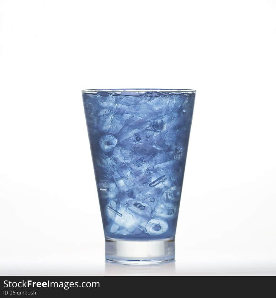 Butterfly pea soft herbal drinks with ice in glass on white background