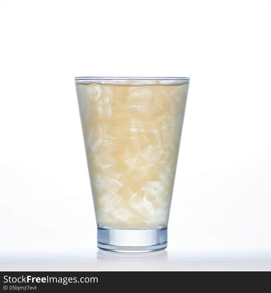 Ginger cold tea Thai herbal drinks with ice in glass on white background