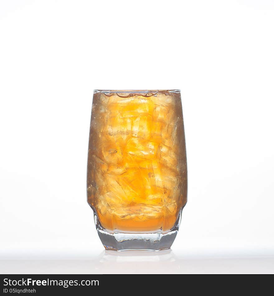 Lemon tea Thai herbal drinks with ice in glass on white background