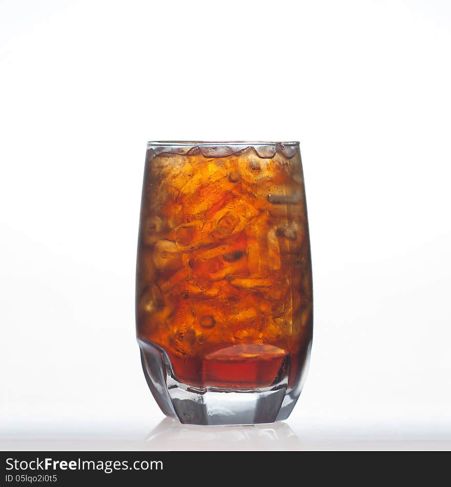 Root beer flavour aerated drinks whit water soda and ice in glass on white background. Root beer flavour aerated drinks whit water soda and ice in glass on white background