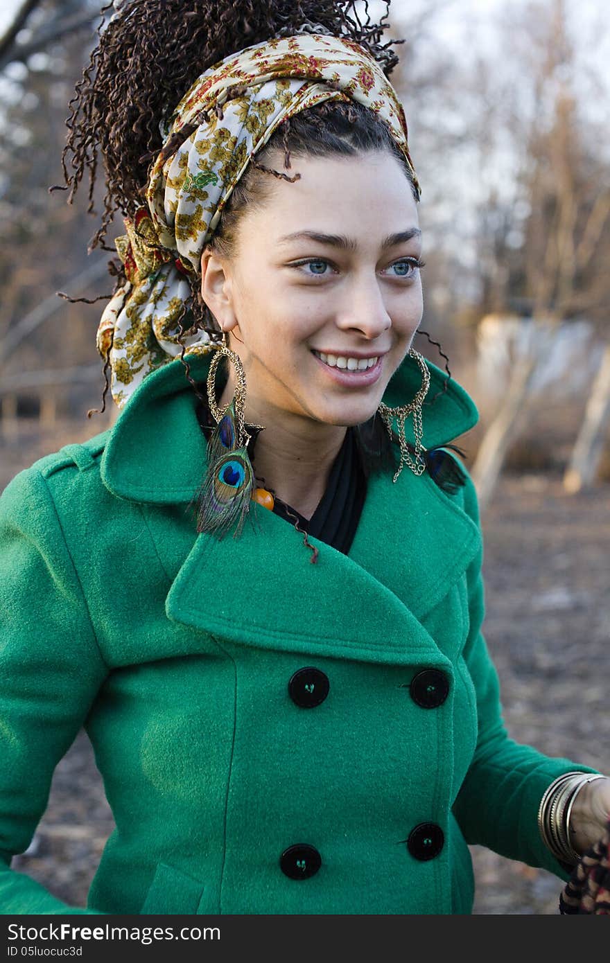 Young cute smiling woman in park