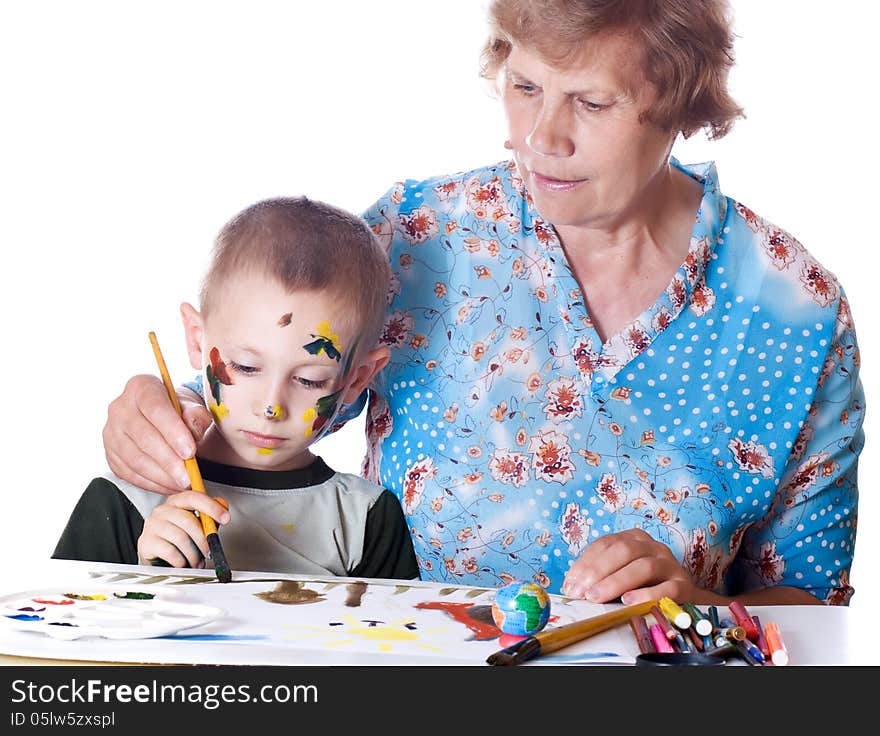 Grandmother teaches his grandson drawing isolated. Grandmother teaches his grandson drawing isolated