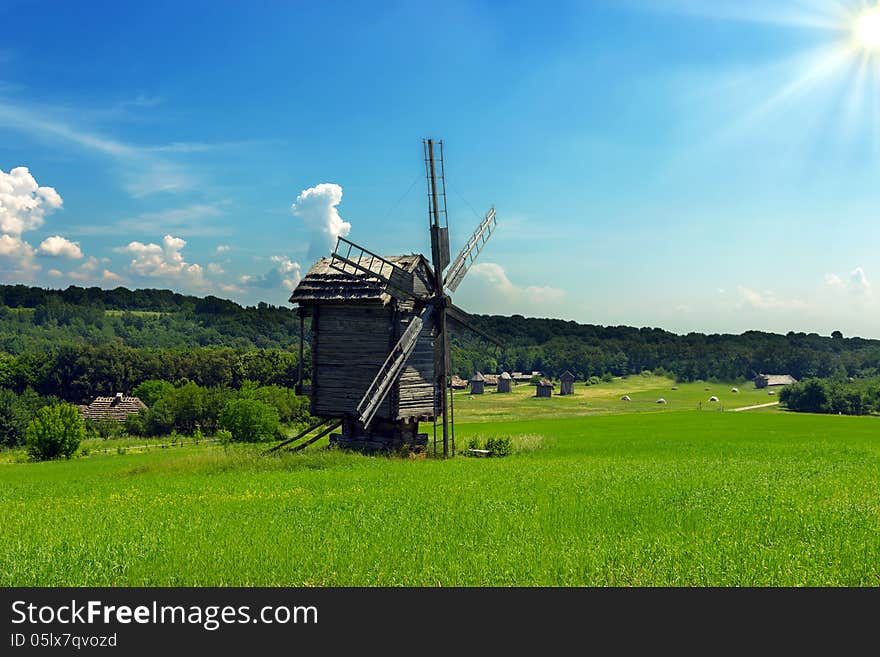 Wooden windmills old near the village in Folk Arts museum Pirogovo, Kiev, Ukraine. Wooden windmills old near the village in Folk Arts museum Pirogovo, Kiev, Ukraine