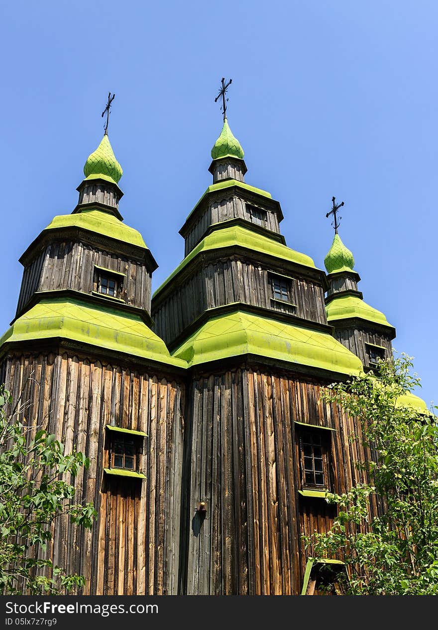 Old wooden church near the village in Folk Arts museum Pirogovo, Kiev, Ukraine. Old wooden church near the village in Folk Arts museum Pirogovo, Kiev, Ukraine