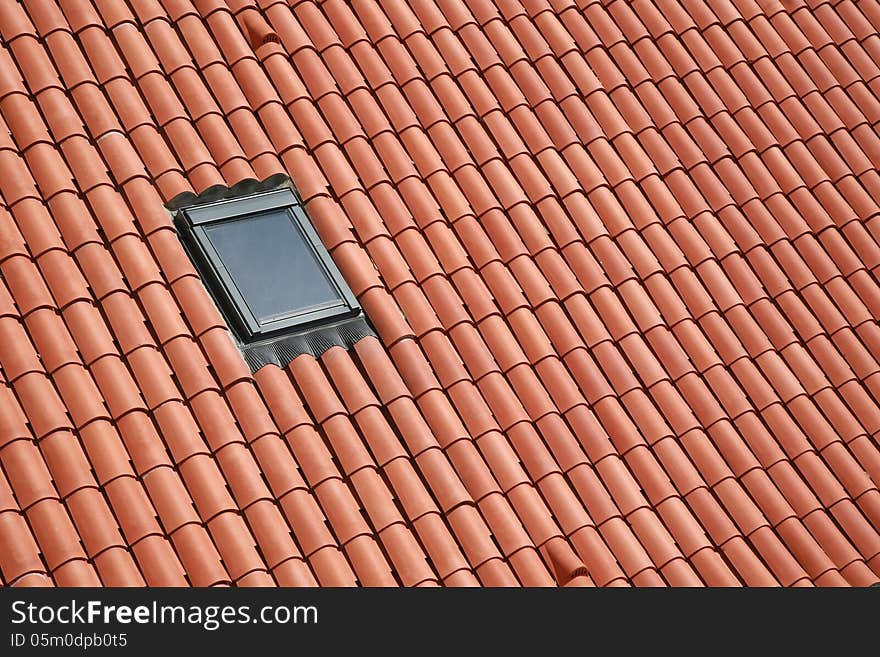 roof from red ceramic tiles with dormer