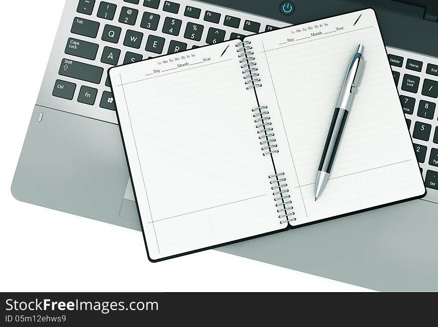 Notepad and pen on a notebook keyboard. white background. Office work