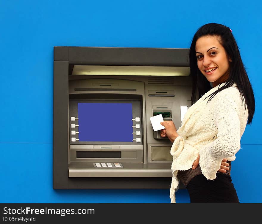 Woman withdraw money from atm