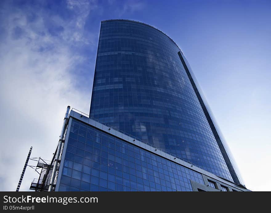 Exterior of the building in the city on a background of blue sky