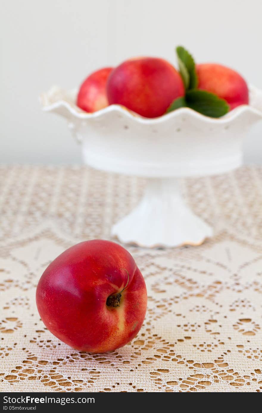 Peaches in a vase on the table. Peaches in a vase on the table