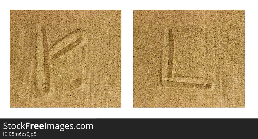 Alphabet letters hand written in sand on beach. Alphabet letters hand written in sand on beach