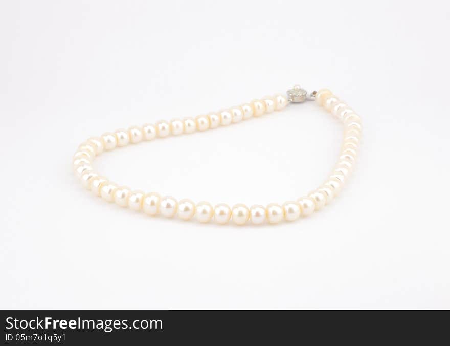 White pearl necklace isolate on white background