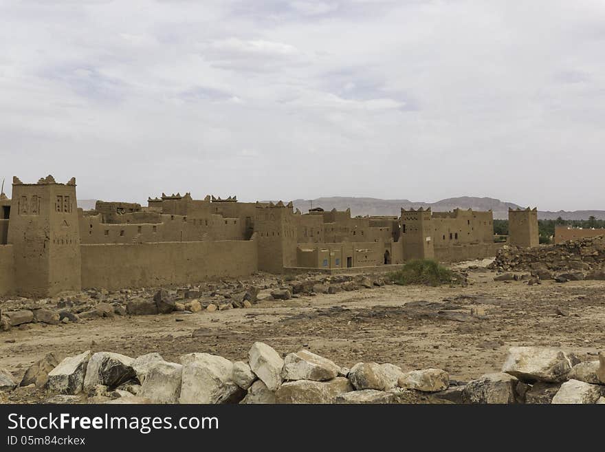 The way from Quarzazate to Zagora , over the mountains from the High Atlas in Morocco. Houses from a kasbah. The way from Quarzazate to Zagora , over the mountains from the High Atlas in Morocco. Houses from a kasbah.