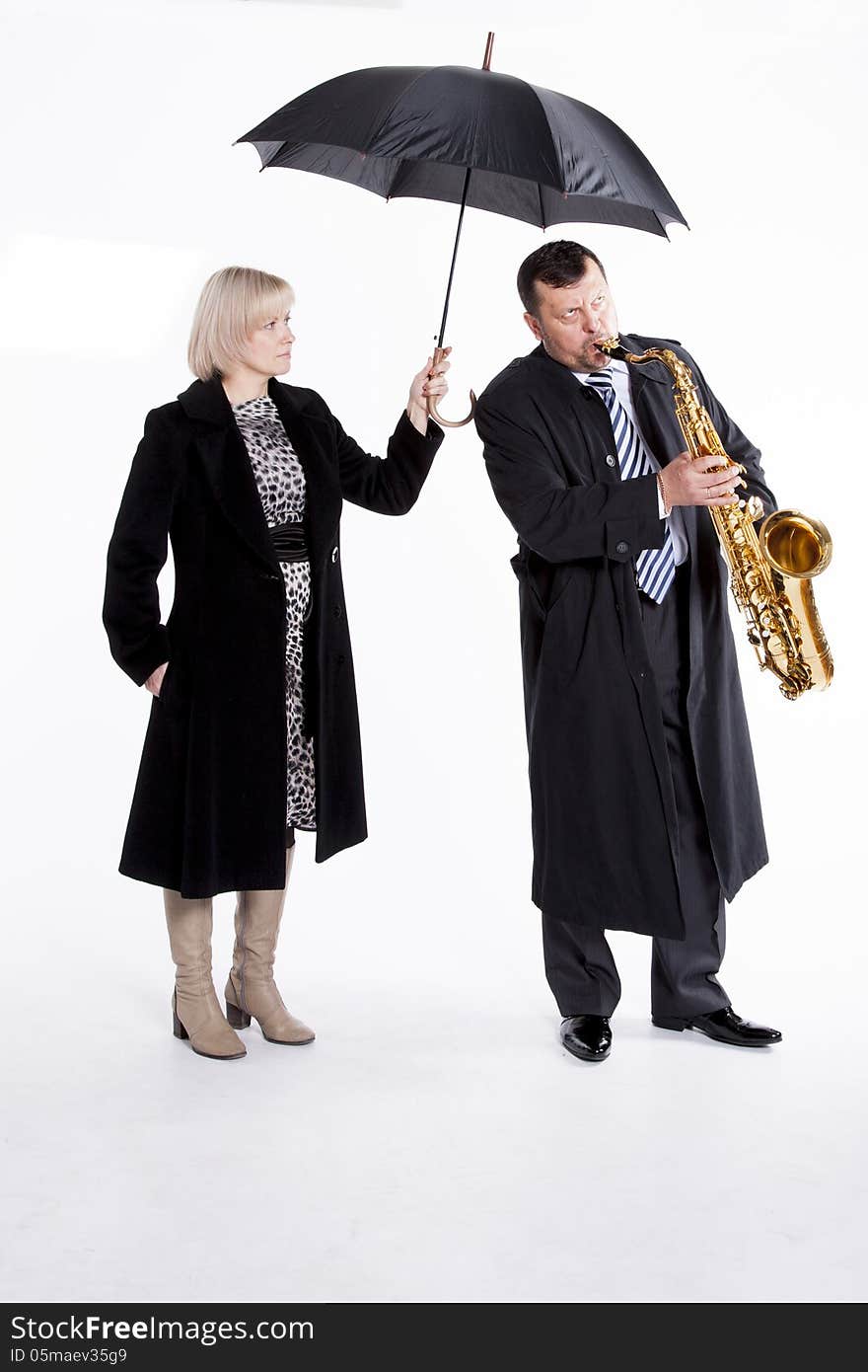 Saxophonist under an umbrella