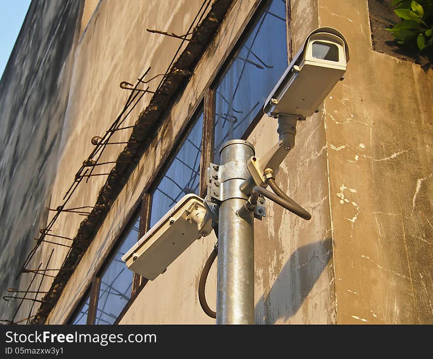 Surveillance cam on building background for security. Surveillance cam on building background for security