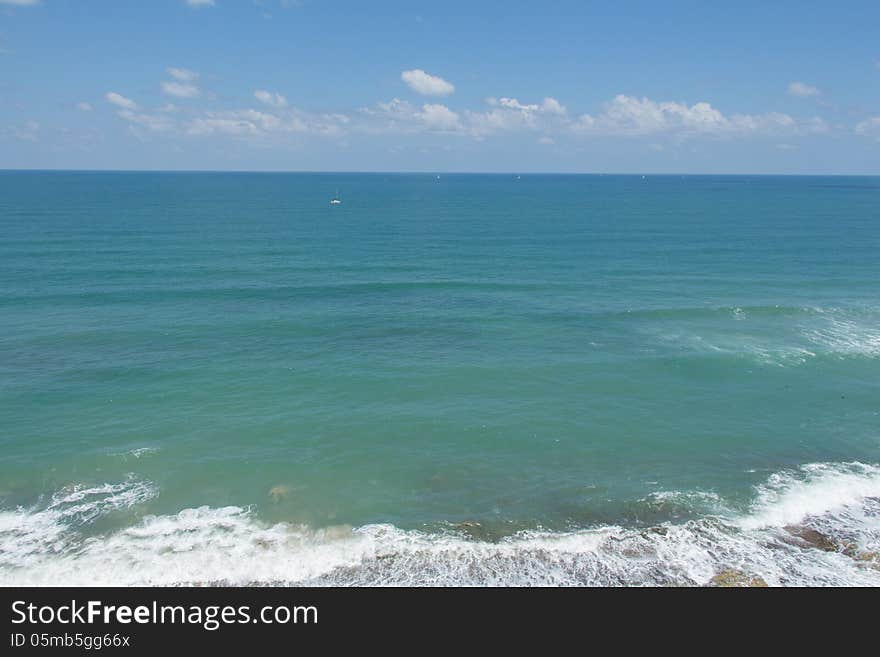 The blue sea under a blue sky.