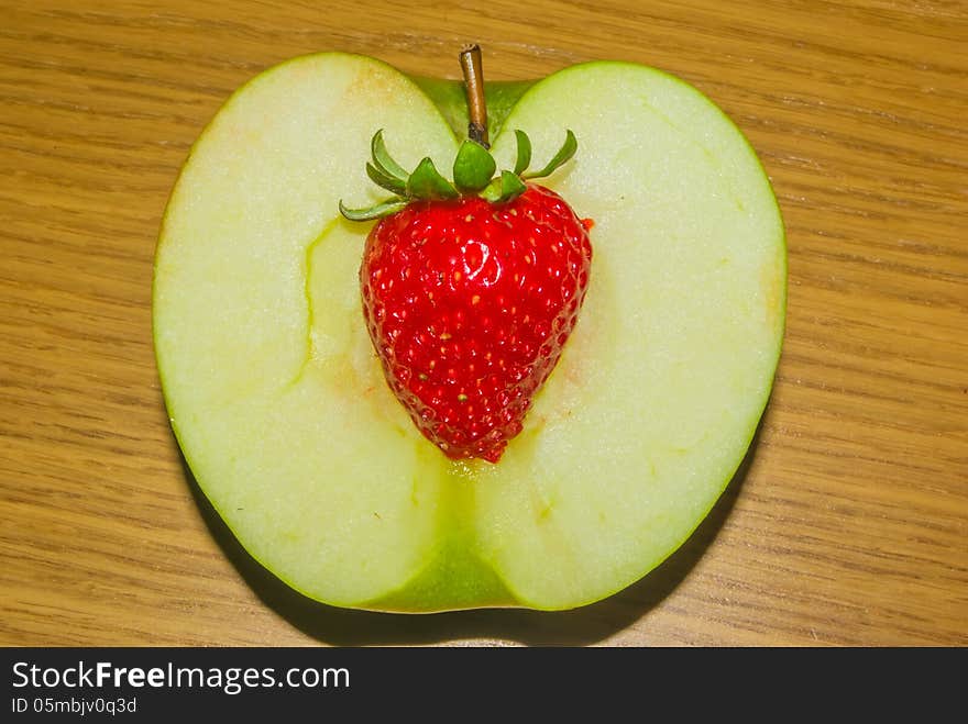 Combination of an apple and a strawberry. Combination of an apple and a strawberry