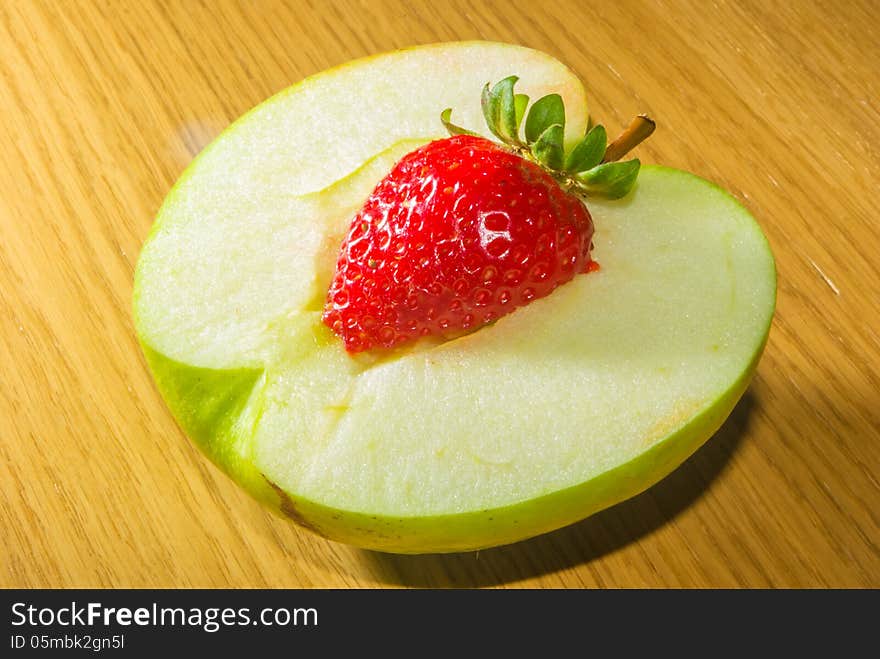 Combination of an apple and a strawberry. Combination of an apple and a strawberry