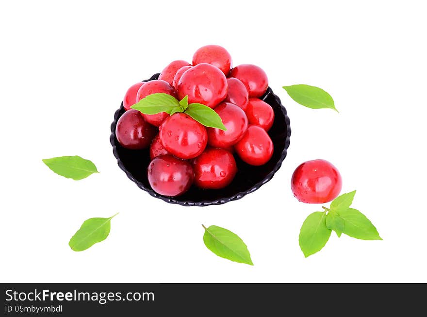 Sweet cherries in a plate isolated on white