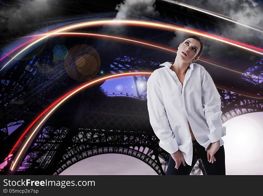 Dreamy woman in white shirt looking up over fantastic abstract background