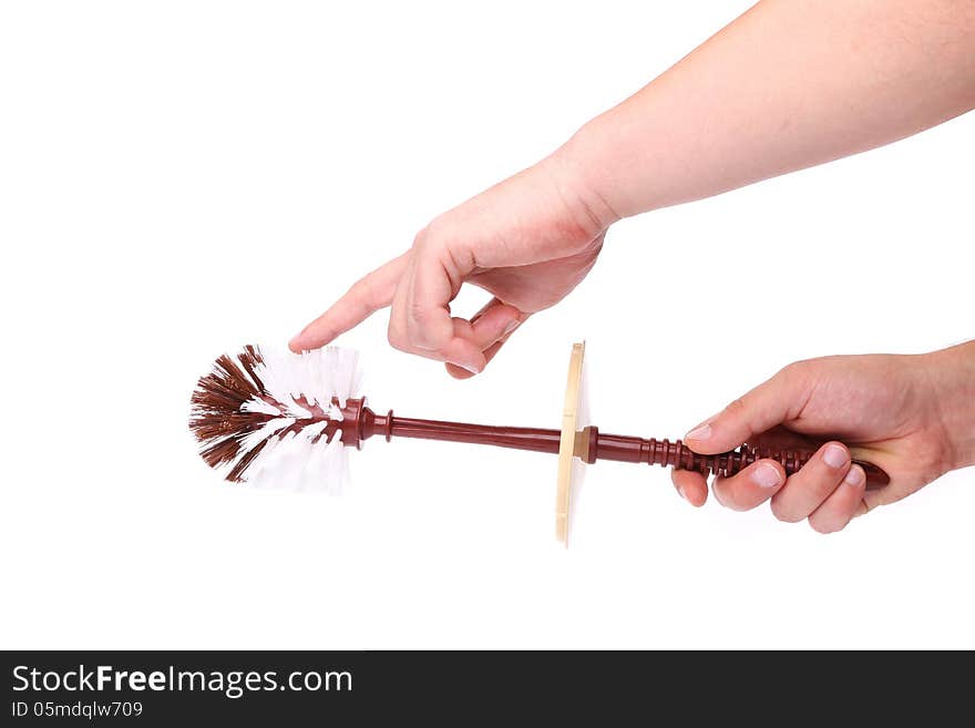 Hand holding brown toilet brush isolated on white background. Hand holding brown toilet brush isolated on white background