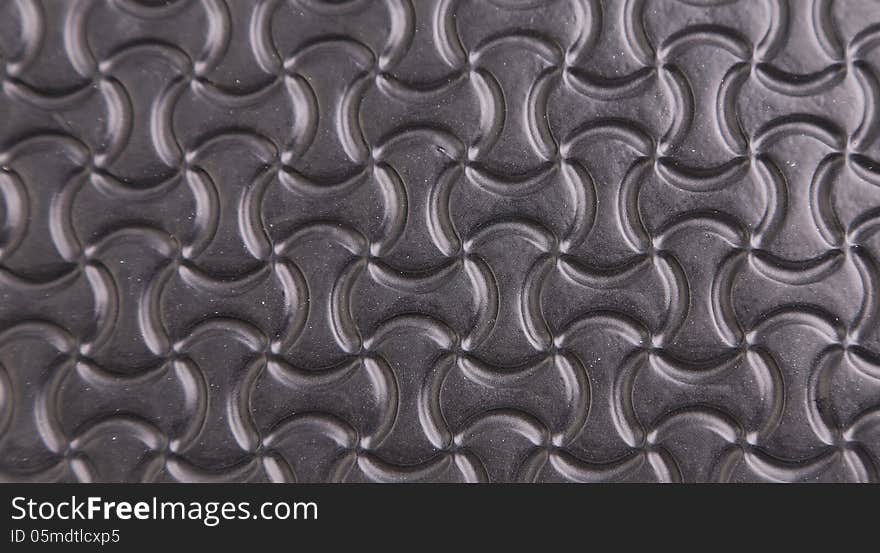 Black background with a pattern of stylized infinity