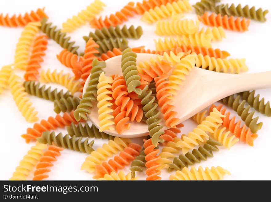 A Pasta Eliche Tricolori And A Wood Spoon.