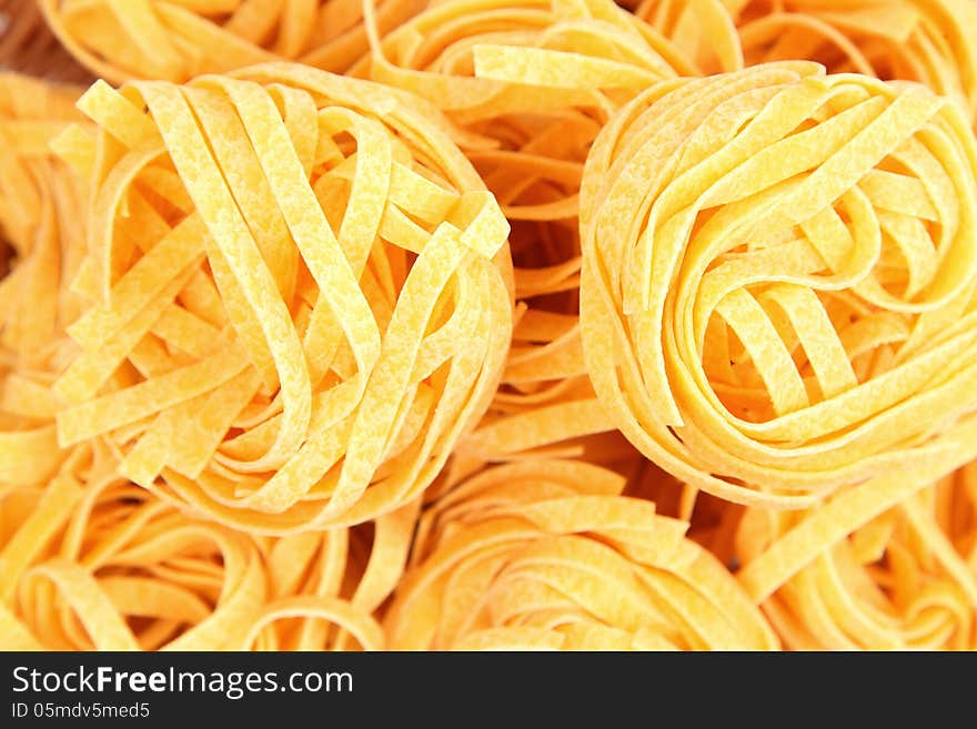 A background of tagliatelle paglia e fieno close-up.